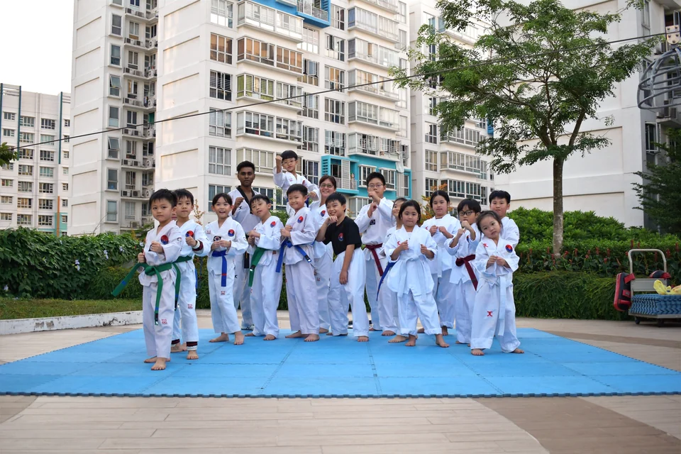 Kids engaged in Taekwondo training at Momentum Taekwondo, Compassvale Crescent.