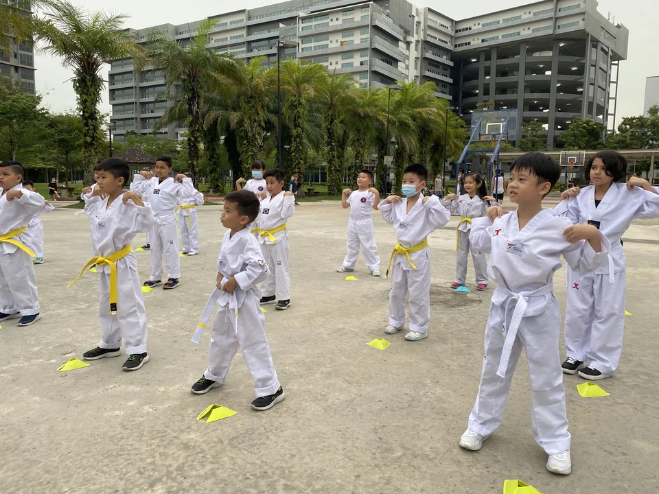 Kids practicing Taekwondo during their classes in Singapore