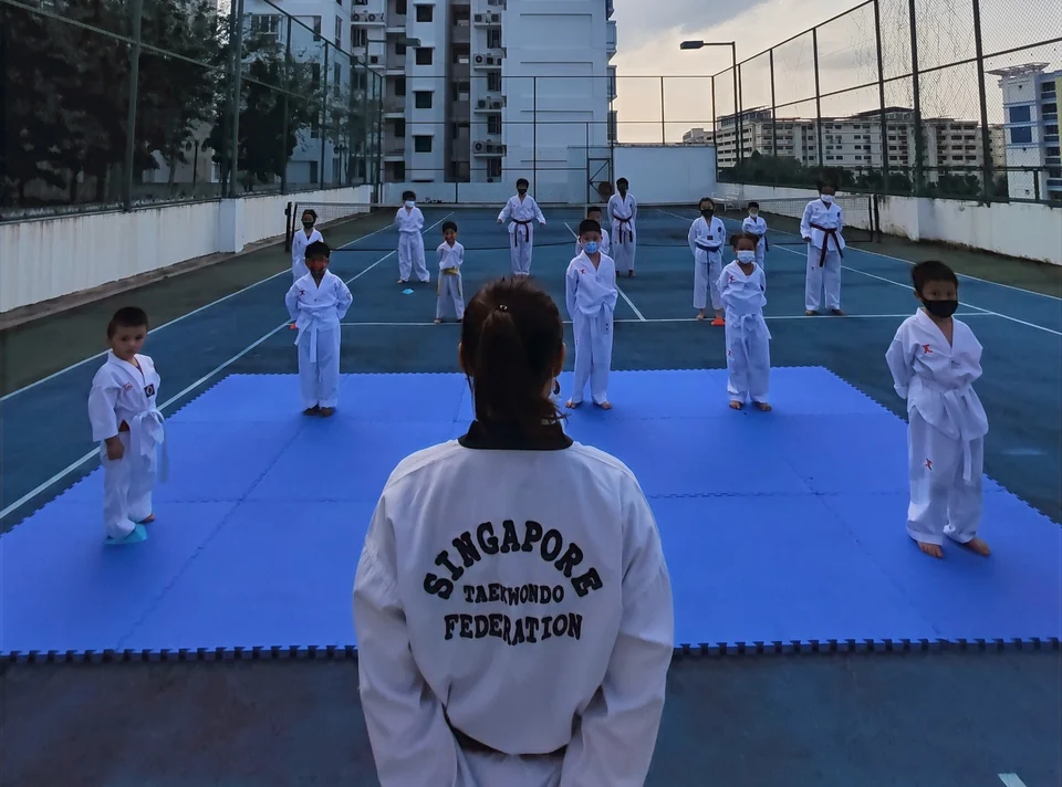 Children getting ready to start their Taekwondo lesson with Momentum Taekwondo Singapore