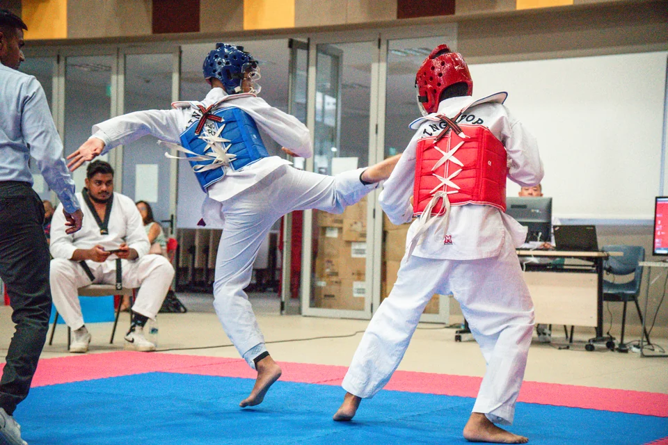 Momentum Taekwondo students and coaches in Singapore