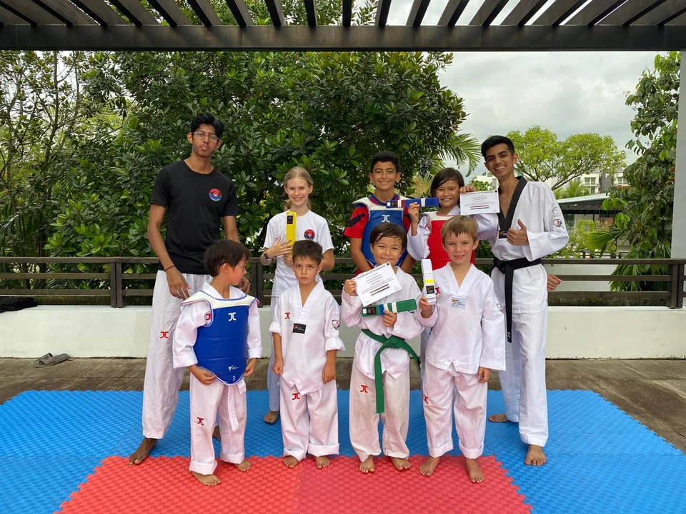 Momentum Taekwondo students and coaches in Singapore
